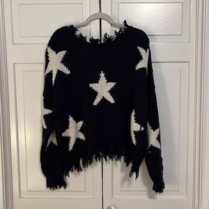 Distressed navy sweater with white stars